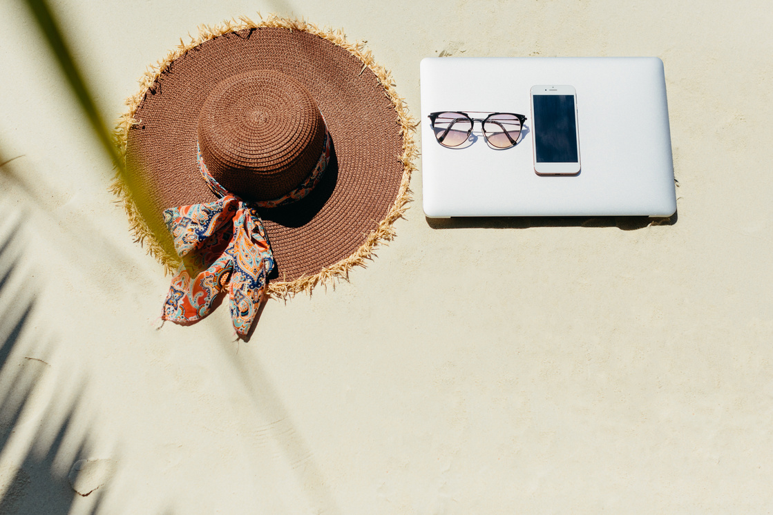 laptop and smartphone on beach